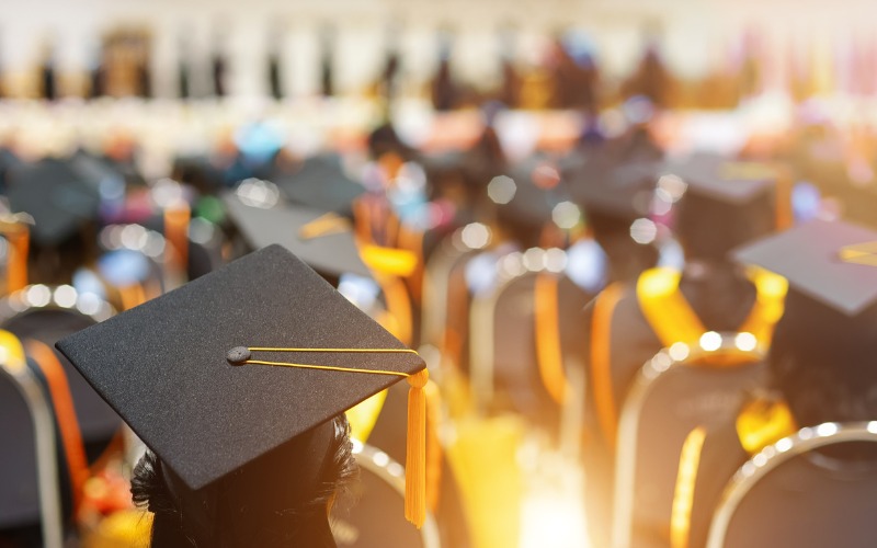 back of graduates in cap and gown